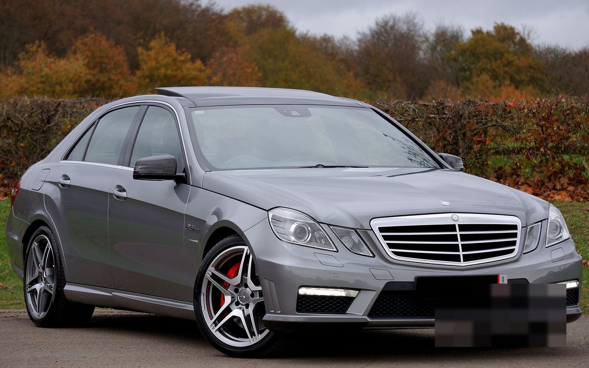 A grey executive sedan, photographed front three-quarter
